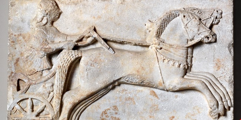 Charioteer driving two horses. Archaic period, 6th century BC.